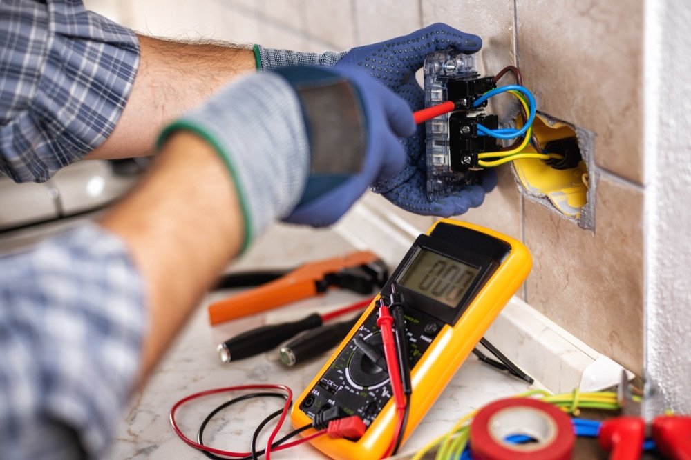 Electrician working on a panel